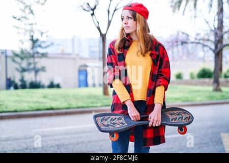 Brunette Teenage Girl in Hipster Outfit (jeans Shorts, Keds, Plaid Shirt,  Hat) with a Skateboard at the Park Stock Photo - Image of caucasian,  active: 47955778