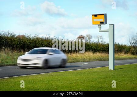 Radar speed camera and fast car on the road Stock Photo