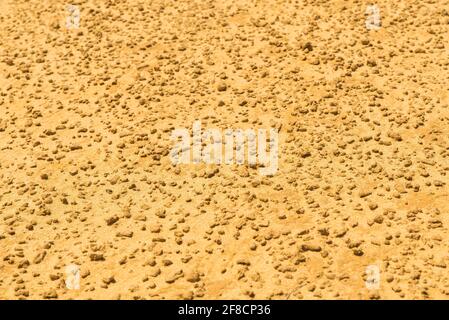 Yellow sand texture background. Close up of yellow sand grains in the desert Stock Photo