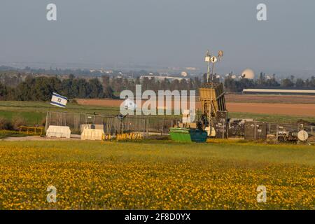 Negev, Israel - March 13th, 2021: An Iron Dome anti rocket battery, deployed in a flower field in the Negev region of Israel. Stock Photo