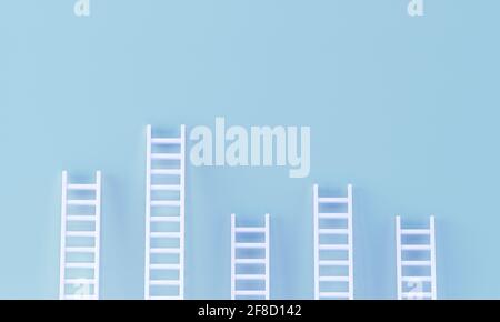 Ladder random collection on pastel blue wall. minimal studio background. 3d rendering Stock Photo