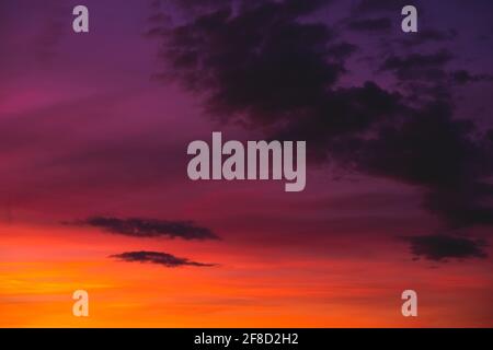 Bright colorful sunset sky with few clouds Stock Photo
