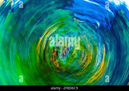 A whirling spiral. Hypnosis spiral, hypnosis concept, abstract background from colorful texture circles. Turquoise, blue, green, blue colors Stock Photo