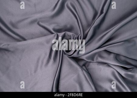 wavy rippled gray blue purple silk satin fabric background Stock Photo