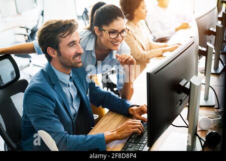 Startup business people group of programmer working as team to find solution to problem Stock Photo