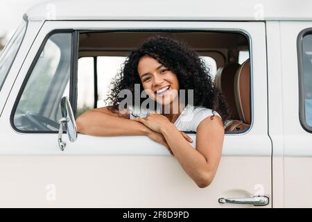 Attractive mixed race woman enjoying road trip Stock Photo