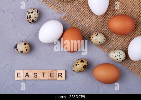 Quail and chicken eggs on a rustic cloth. Stock Photo