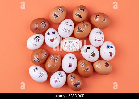 Top view white and brown eggs with faces. Stock Photo