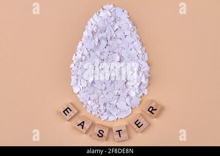 Huge egg made of broken eggshell pieces. Stock Photo