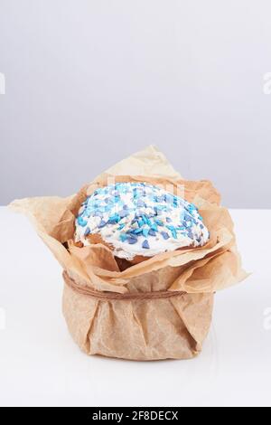 Easter cake wrapped in paper. Stock Photo