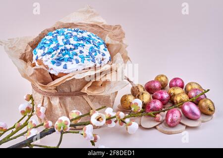 Easter cupcake with icing wrapped in a paper. Stock Photo