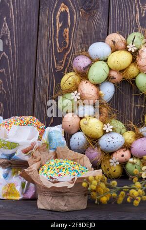 Colorful eggs with cakes and willow. Stock Photo