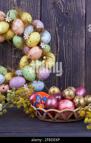 Colored easter eggs and yellow willow branch. Stock Photo