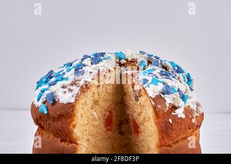 Top of easter cake with white icing and blue topping. Stock Photo