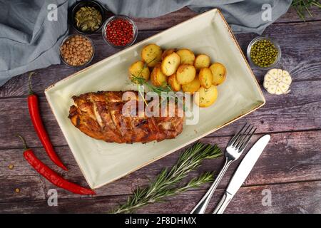 baked pork ribs on a wooden table, top view Stock Photo
