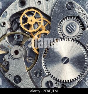 Metal gears of old clock mechanism Stock Photo