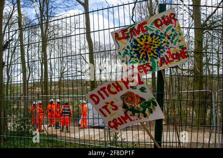 Aylesbury Vale, UK. 9th April, 2021. Banners in the woods. HS2 were back in the ancient woodland of Jones Hill Wood today felling trees. Environmental activists trying to protect Jones Hill Wood are taking legal action against Natural England who granted the licence to HS2 fell Jones Hill Wood despite it having rare barbastelle bats in the wood. The controversial and massively over budget High Speed 2 rail link from London to Birmingham is carving a huge scar across the Chilterns which is an AONB. Credit: Maureen McLean/Alamy Stock Photo