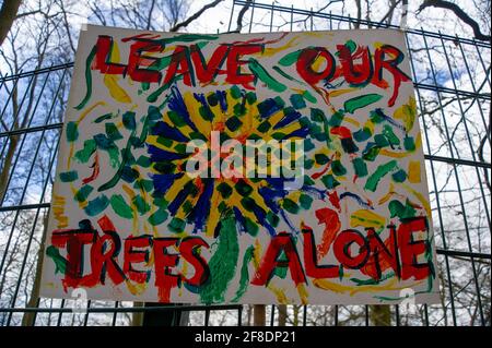 Aylesbury Vale, UK. 9th April, 2021. Banners in the woods. HS2 were back in the ancient woodland of Jones Hill Wood today felling trees. Environmental activists trying to protect Jones Hill Wood are taking legal action against Natural England who granted the licence to HS2 fell Jones Hill Wood despite it having rare barbastelle bats in the wood. The controversial and massively over budget High Speed 2 rail link from London to Birmingham is carving a huge scar across the Chilterns which is an AONB. Credit: Maureen McLean/Alamy Stock Photo