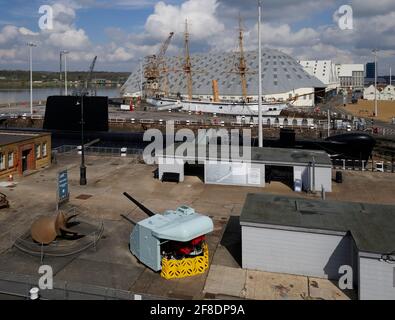 AJAXNETPHOTO. 3RD APRIL, 2019. CHATHAM, ENGLAND. - HISTORIC DOCKYARD -  HMS GANNET, A COMPOSITE HULLED TEAK AND IRON FRAMED STEAM AND SAIL POWERED VICTORIAN SLOOP BUILT AT SHEERNESS IN 1878. AFTER 90 YEARS SERVICE AS A GLOBAL PATROL SHIP AND AS  THE TRAINING SHIP T.S. MERCURY BASED ON THE HAMBLE RIVER NEAR SOUTHAMPTON, SHE WAS RESTORED AND NOW RESIDES IN NR 4 DRY-DOCK AT THE CHATHAM HISTORIC DOCKYARD. THE SUBMARINE HMS OCELOT CAN BE SEEN DRYDOCKED NEAREST CAMERA. PHOTO:JONATHAN EASTLAND/AJAXREF:GX8190304 123 Stock Photo