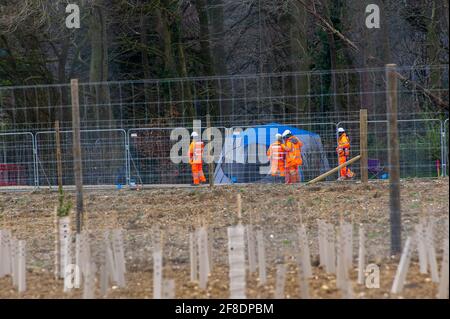 Aylesbury Vale, UK. 9th April, 2021. HS2 were back in the ancient woodland of Jones Hill Wood today felling trees. Environmental activists trying to protect Jones Hill Wood are taking legal action against Natural England who granted the licence to HS2 fell Jones Hill Wood despite it having rare barbastelle bats in the wood. The controversial and massively over budget High Speed 2 rail link from London to Birmingham is carving a huge scar across the Chilterns which is an AONB. Credit: Maureen McLean/Alamy Stock Photo