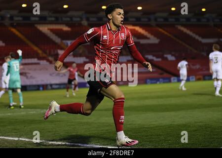 LINCOLN, UK. APRIL 13TH: Brennan Johnson of Lincoln City celebrates his ...