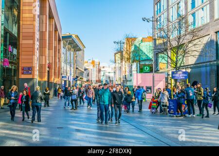 LIVERPOOL, UNITED KINGDOM, APRIL 7, 2017: People are walking through the business center of Liverpool, England Stock Photo