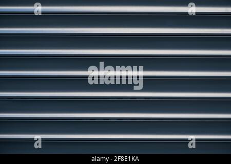 Metallic background. A metal surface with horizontal stripes. Stock Photo