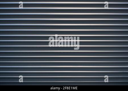 Metallic background. A metal surface with horizontal stripes. Stock Photo