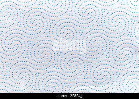 detail of a white paper kitchen towel with blue wave shapes Stock Photo