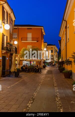 DESENZANO DEL GARDA, ITALY, JULY 23, 2019: Sunset view of a street in Desenzano del Garda in Italy Stock Photo