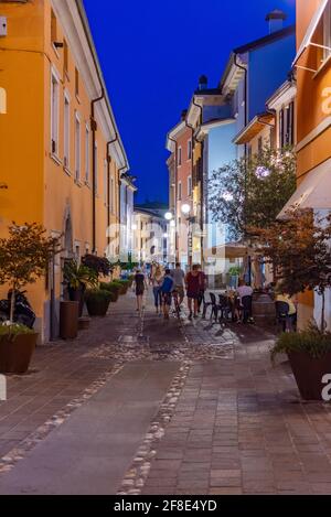 DESENZANO DEL GARDA, ITALY, JULY 23, 2019: Sunset view of a street in Desenzano del Garda in Italy Stock Photo