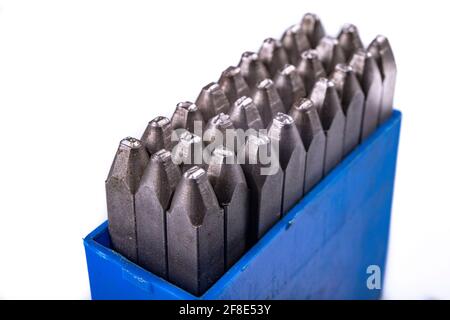 Metal letter stamps. Accessories for locksmiths for marking devices. Isolated background. Stock Photo