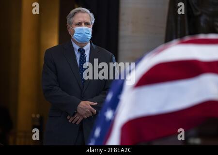 Washington, United States. 13th Apr, 2021. Sen. John Hoeven, R-N.D., pays respects to U.S. Capitol Officer William 'Billy' Evans, as his remains lie in honor in the Capitol Rotunda in Washington, DC, on Tuesday, April 13, 2021. Evans was killed when a driver rammed the north barricade of the Capitol on April 2, 2021. Pool Photo By Tom Williams/UPI Credit: UPI/Alamy Live News Stock Photo