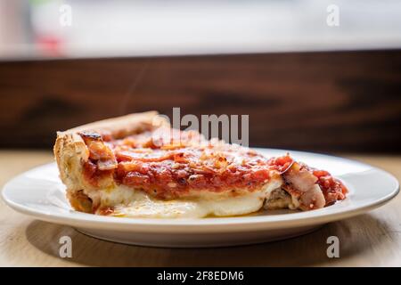 A Delicious Slice of Chicago's World Famous Deep Dish Pizza. Stock Photo