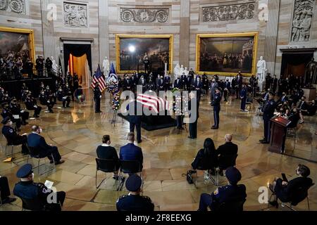 (210414) -- WASHINGTON, April 14, 2021 (Xinhua) -- U.S. President Joe Biden pays his respect to U.S. Capitol Police officer William 'Billy' Evans at the Capitol Hill in Washington, DC, April 13, 2021. William 'Billy' Evans, the 18-year Capitol Police officer killed while in the line of duty when a car rammed into him and another officer, lay in honor in the Capitol Rotunda on Tuesday. (Amr Alfiky/Pool via Xinhua) Stock Photo