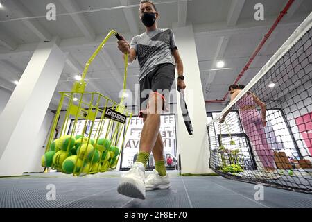 Philip Hinder participates in a tennis class at the Tennis Innovator