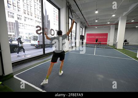 Philip Hinder participates in a tennis class at the Tennis Innovator