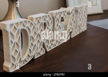 Decoration letters dream on table. Word dream on a table. Home sweet home Stock Photo