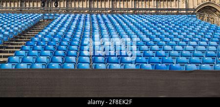 Empty rows of chairs, seats in the concert hall, in the sports hall. Stock Photo