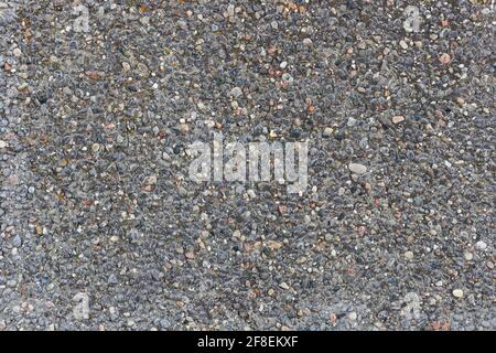 Gray stone textured background. Detailed small stones on the wall. Stock Photo