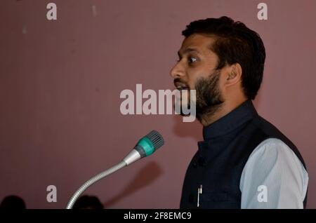 Man asian is giving lecture in a public hall during a function Stock Photo