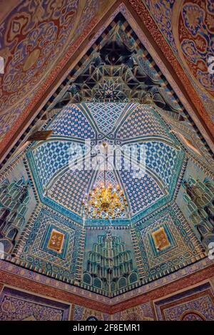 The interiors feature tile decorations in the mihrab (a niche indicating the direction of Mecca) and on the ceiling of the antechamber where pilgrims Stock Photo