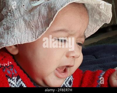 Innocent new born baby kid asian colour looks very beautiful. Stock Photo