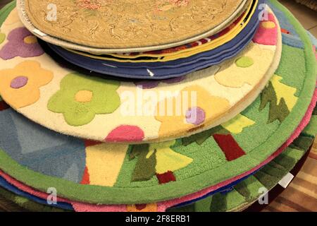Heap of the colorful carpets at market Stock Photo