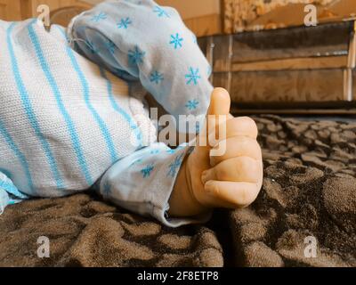 Smiling kid photographs at home under blanket looks beautiful. Digital and 4k photos of child. Stock Photo