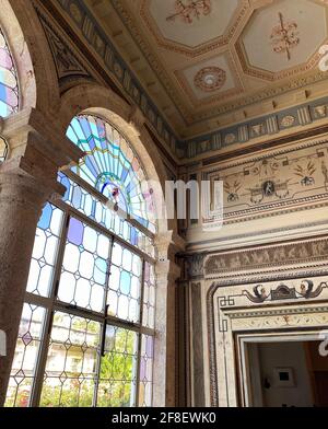 Inside the The Vizcaya Museum and Garden in Miami Florida. Beautiful tea room with stained glass windows & doors and beautiful ceiling and wall decor Stock Photo