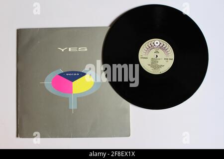 English Pop Rock and new wave band, Yes music album on vinyl record LP disc. Titled: 90125 Stock Photo