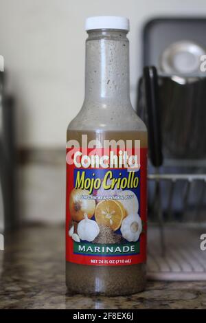 Bottle of Conchita' Mojo Criollo which is used for cooking in a Hispanic family. Conchita's Mojo marinade can be used with meat poultry fish & chicken Stock Photo