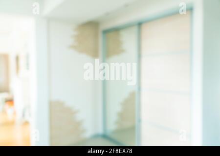 Blurred office interior space background. Unfocused office place. Blur background with bokeh lights. Stock Photo