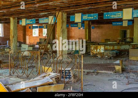 Broken convenience store inside of Pripyat town in the Ukraine Stock Photo
